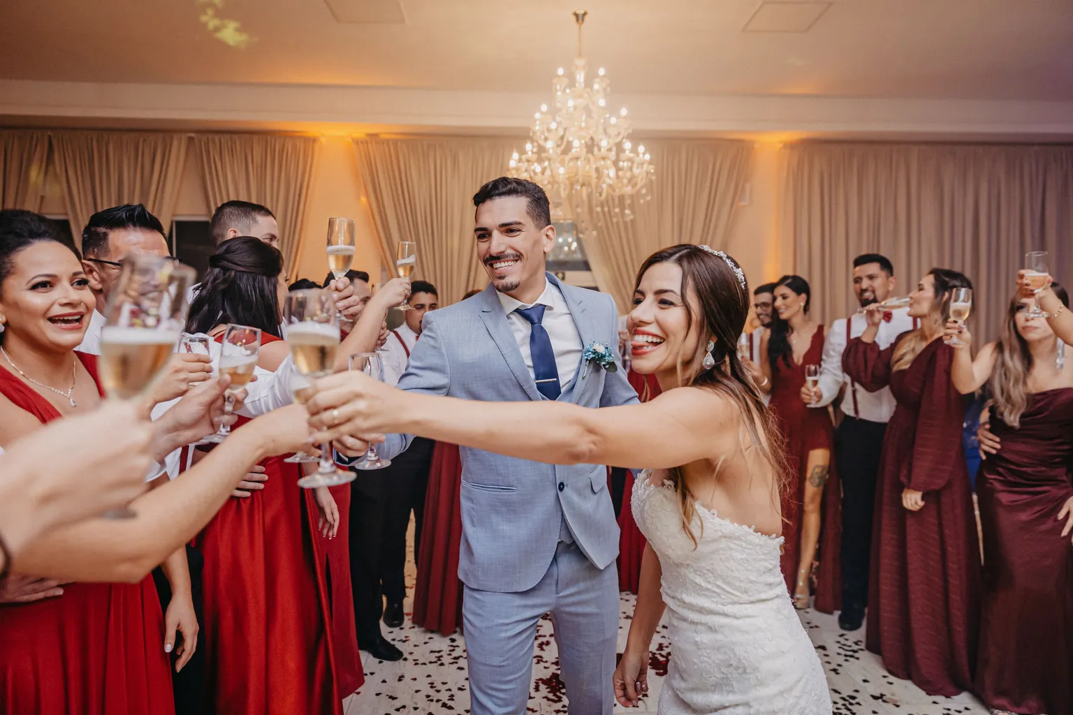 Guests toasting with the newlyweds at a reception